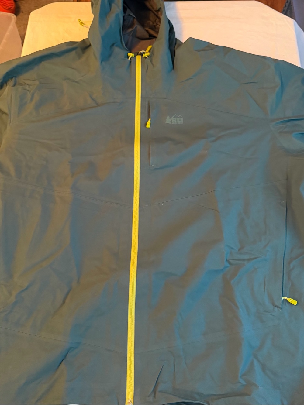 REI Men’s Hooded Waterproof Raincoat in Teal with Yellow Zipper